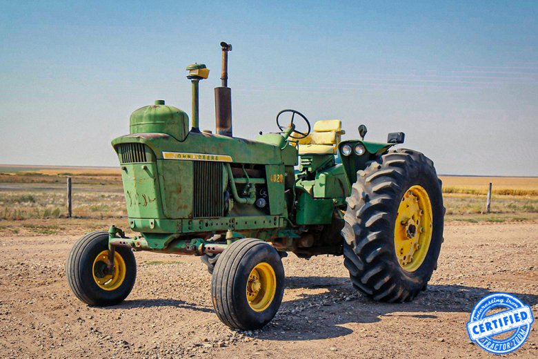 John Deere Tractor in the Field at Night Feeding Cowsht