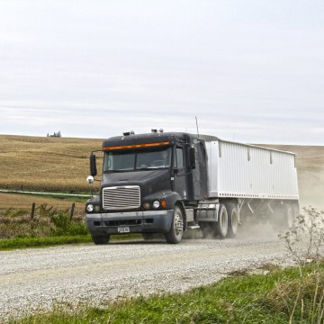 A semi on a gravel road.